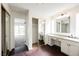 Bright bathroom features double sinks, vanity area, and closet with mirror doors at 6330 Spring Meadow Dr, Las Vegas, NV 89103