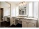 Bathroom with double sinks, vanity, and updated lighting fixtures at 6330 Spring Meadow Dr, Las Vegas, NV 89103