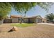 Charming single-story home with a low-maintenance front yard and attached garage at 6330 Spring Meadow Dr, Las Vegas, NV 89103