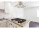 Modern kitchen featuring granite countertops, stainless appliances and island cooktop at 6330 Spring Meadow Dr, Las Vegas, NV 89103