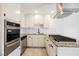 Modern kitchen with stainless steel appliances and a stylish range hood at 6330 Spring Meadow Dr, Las Vegas, NV 89103