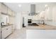 Bright kitchen featuring modern appliances, granite countertops, and white cabinetry at 6330 Spring Meadow Dr, Las Vegas, NV 89103