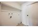 Laundry room with tile flooring, convenient shelving, and a door leading to other areas of the home at 6330 Spring Meadow Dr, Las Vegas, NV 89103