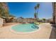 Sparkling swimming pool surrounded by lush landscaping and a concrete patio for outdoor relaxation at 6330 Spring Meadow Dr, Las Vegas, NV 89103