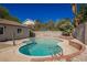 Beautiful pool and landscaped backyard perfect for outdoor relaxation and entertainment at 6330 Spring Meadow Dr, Las Vegas, NV 89103