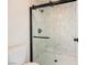 Walk-in shower features glass door and updated shower tile at 6330 Spring Meadow Dr, Las Vegas, NV 89103