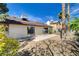 Home features a stucco exterior, sliding glass doors, a patio, and low-maintenance gravel landscaping at 6521 Faith Peak Dr, Las Vegas, NV 89108