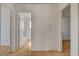 Hallway with tile flooring offers glimpses of bathroom and bedroom, enhancing the property's appeal at 6521 Faith Peak Dr, Las Vegas, NV 89108