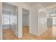 Hallway with tile flooring showcases the home's interior rooms, providing depth and connectivity at 6521 Faith Peak Dr, Las Vegas, NV 89108