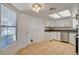 The kitchen includes white cabinets, stainless steel appliances, and a view of the backyard at 6521 Faith Peak Dr, Las Vegas, NV 89108