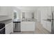 Modern kitchen with stainless steel appliances, white cabinets, and quartz countertops at 6761 Violet Cascade Ave, Las Vegas, NV 89156