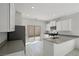 Modern kitchen with stainless steel appliances, white cabinets, and quartz countertops at 6761 Violet Cascade Ave, Las Vegas, NV 89156