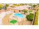 Expansive backyard featuring a sparkling pool, spa, and outdoor entertainment area, perfect for relaxing and enjoying the outdoors at 7119 Wolf Rivers Ave, Las Vegas, NV 89131