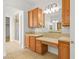 Bathroom featuring dual sinks, vanity, and tile floor with doorway view of shower and water closet at 7119 Wolf Rivers Ave, Las Vegas, NV 89131