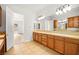 Spacious bathroom features dual sinks, tile floor, and a bright, airy feel at 7119 Wolf Rivers Ave, Las Vegas, NV 89131
