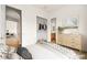 Virtually staged bedroom with open closet and bathroom at 7119 Wolf Rivers Ave, Las Vegas, NV 89131