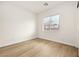Bedroom with light wood laminate flooring and natural light at 7119 Wolf Rivers Ave, Las Vegas, NV 89131