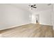 Bright, spacious bedroom features ceiling fan, wood-look floors, and attached bath at 7119 Wolf Rivers Ave, Las Vegas, NV 89131