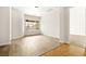 Bright, vacant room featuring fresh paint, hardwood floors and a view of the back yard at 7119 Wolf Rivers Ave, Las Vegas, NV 89131