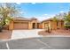 Inviting single-story home featuring a three-car garage, tile roof, and well-maintained landscaping at 7119 Wolf Rivers Ave, Las Vegas, NV 89131