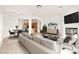 Bright living room with a fireplace, modern furnishings, and an open layout, perfect for entertaining at 7119 Wolf Rivers Ave, Las Vegas, NV 89131