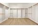 Spacious walk-in closet featuring open shelving and wooden clothing rods at 7119 Wolf Rivers Ave, Las Vegas, NV 89131