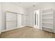 Large walk-in closet with clothing rods and access to a tiled bathroom at 7119 Wolf Rivers Ave, Las Vegas, NV 89131