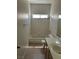 Bathroom with white tile, tub-shower combination, and vanity with sink at 7228 Chic Ave, Las Vegas, NV 89129
