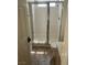 Bathroom features a shower with glass doors, tile floors, and a toilet at 7228 Chic Ave, Las Vegas, NV 89129