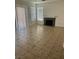 Bright living room features tile floors, a fireplace, and sliding doors at 7228 Chic Ave, Las Vegas, NV 89129