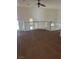 Spacious loft area with neutral walls and carpet, plus natural light from a large window at 7228 Chic Ave, Las Vegas, NV 89129