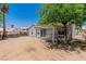 Large backyard features covered patio, mature shade tree, and access to home at 831 Purple Sage Ter, Henderson, NV 89015