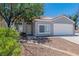 Charming single-Gathering home with a well-maintained front yard and an attached two-car garage at 831 Purple Sage Ter, Henderson, NV 89015