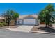 Street view of a cozy home with an attached two-car garage and low-maintenance front yard at 831 Purple Sage Ter, Henderson, NV 89015