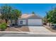 Charming home with a two-car garage, surrounded by mature trees and low-maintenance landscaping at 831 Purple Sage Ter, Henderson, NV 89015