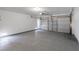 Clean garage features speckled flooring and an automatic door at 831 Purple Sage Ter, Henderson, NV 89015