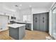 Modern kitchen featuring an island, stainless steel appliances, and ample cabinet space at 831 Purple Sage Ter, Henderson, NV 89015
