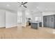 Spacious living room with light wood floors, open floor plan, and abundant natural light at 831 Purple Sage Ter, Henderson, NV 89015