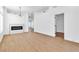 Open living space featuring modern fireplace, light wood floors and plenty of natural light at 831 Purple Sage Ter, Henderson, NV 89015