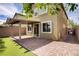 Backyard view with a covered patio and brick pavers at 9035 Drummer Bay Ave, Las Vegas, NV 89149