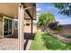 Backyard oasis with manicured lawn and covered patio at 9035 Drummer Bay Ave, Las Vegas, NV 89149