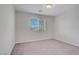 Neutral bedroom with carpet flooring and natural light at 9035 Drummer Bay Ave, Las Vegas, NV 89149