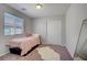 Bedroom with a door closet, window and carpeting at 9035 Drummer Bay Ave, Las Vegas, NV 89149