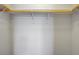 Walk-in closet with one shelf and wooden bar at 9035 Drummer Bay Ave, Las Vegas, NV 89149