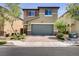 Charming two-story home with a brick driveway, a two-car garage, and low maintenance landscaping at 9035 Drummer Bay Ave, Las Vegas, NV 89149