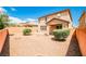 A spacious backyard with desert landscaping, perfect for outdoor activities and relaxation under the sun at 9271 Martel Ave, Las Vegas, NV 89148
