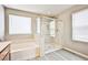 Bathroom with soaking tub, glass shower and dual windows providing lots of natural light at 9271 Martel Ave, Las Vegas, NV 89148