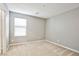 Cozy, neutral bedroom with carpet, window, and ample natural light at 9271 Martel Ave, Las Vegas, NV 89148