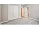 Neutral bedroom with vinyl floors, closet space, and an ensuite bathroom at 9271 Martel Ave, Las Vegas, NV 89148