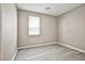 Bedroom featuring wood-look flooring and a sunny window at 9271 Martel Ave, Las Vegas, NV 89148